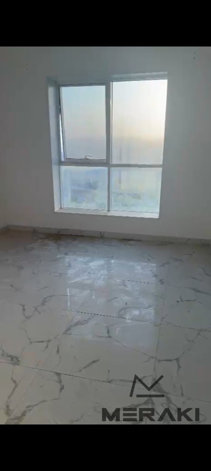 A one-bedroom apartment with a living room at a bargain price in oasis Towers, with a fully open view in the heart of Ajman, beautiful tower