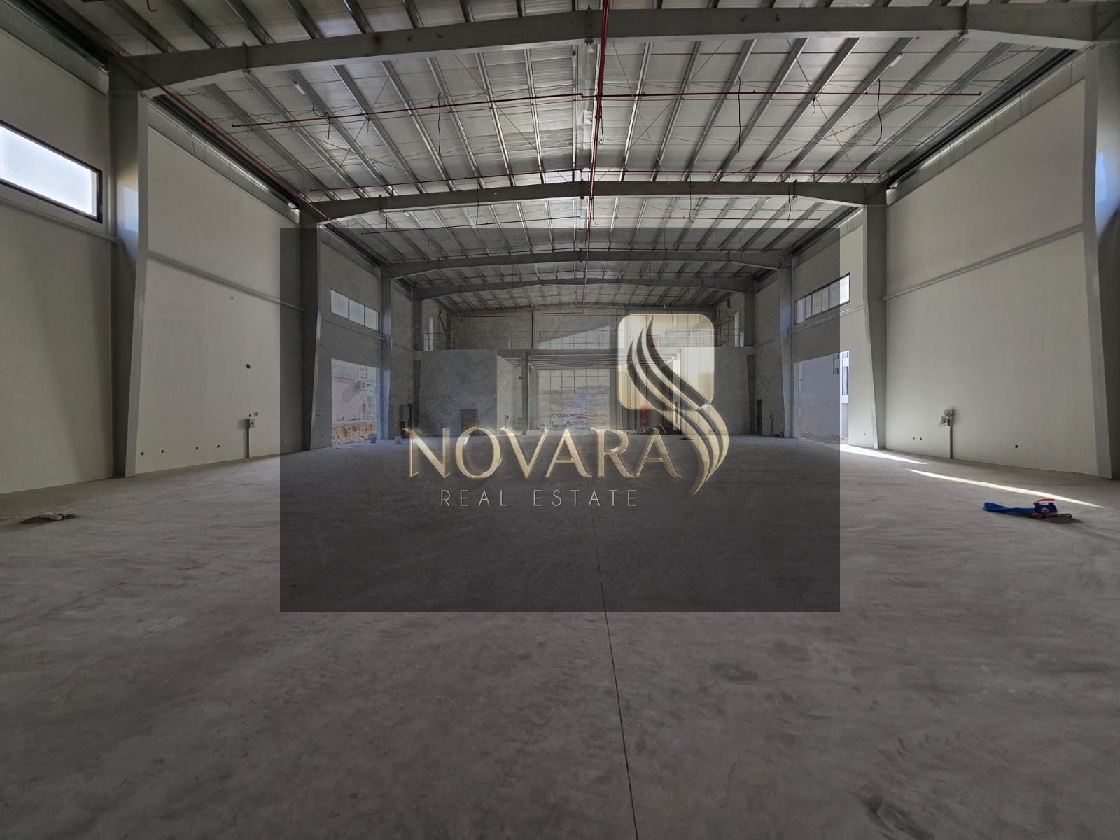 Great opportunity _ 253 kW electricity _ 25,000 sq. ft. area _ to rent a spacious and well-equipped warehouse in a strategic location in Umm Al Quwain