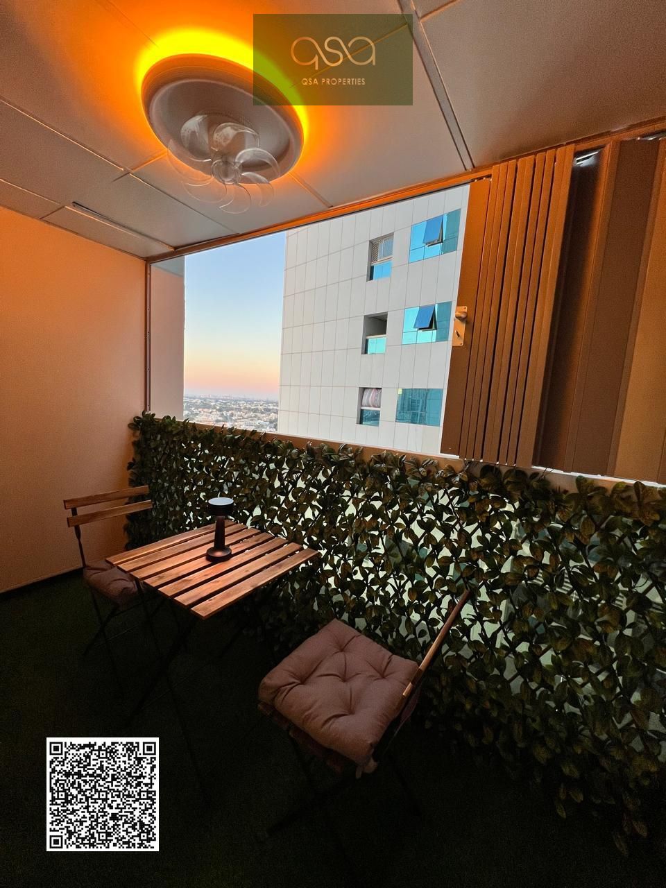 One-bedroom apartment for sale in Ajman Pearl Tower with parking and an open view of Ajman Creek.