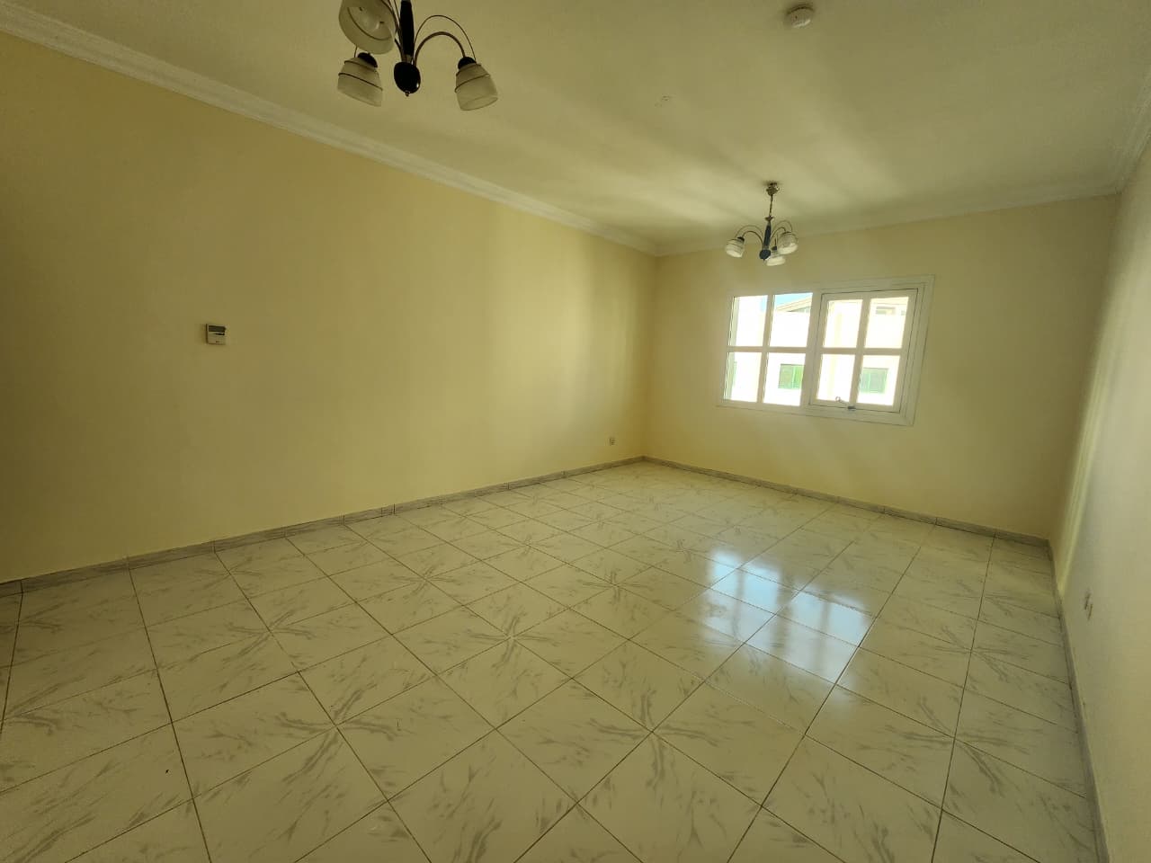 Two-bedroom apartment in Al Qasimia Al Nad with a very spacious living area, two bathrooms, clean and close to all services.
