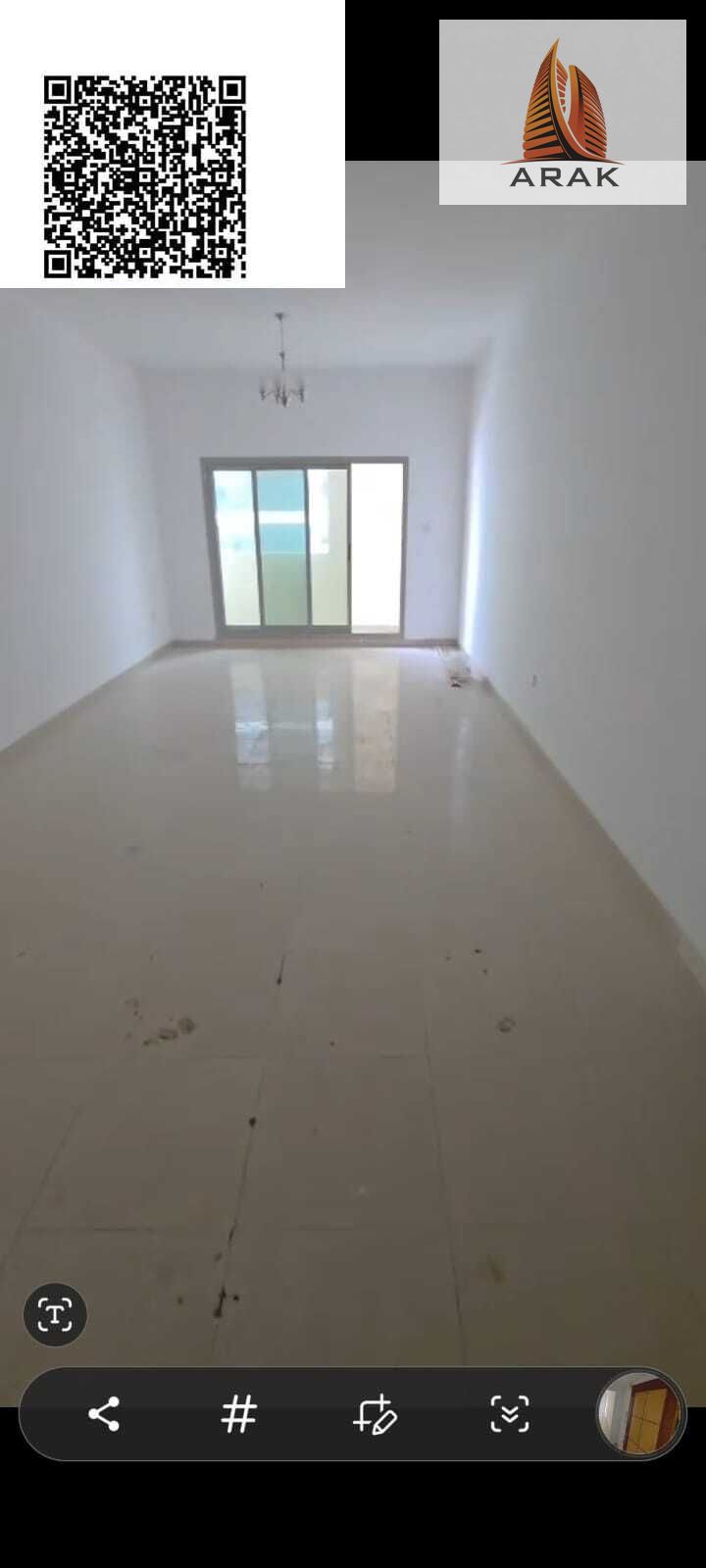 For annual rent, a two-bedroom apartment with a living room located in a residential tower in Al Rashidiya 3