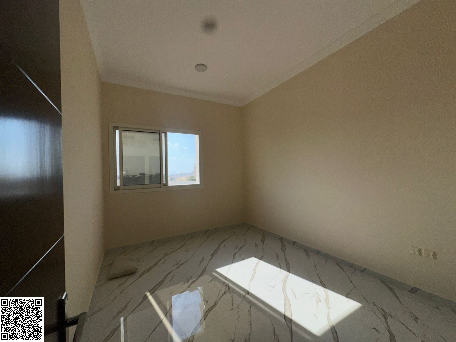 Two bedrooms, a living room, and three bathrooms. Second-hand apartment in Al-Muwayhat 2, near Sheikh Ammar Street and close to the Mohammed Bin Zayed