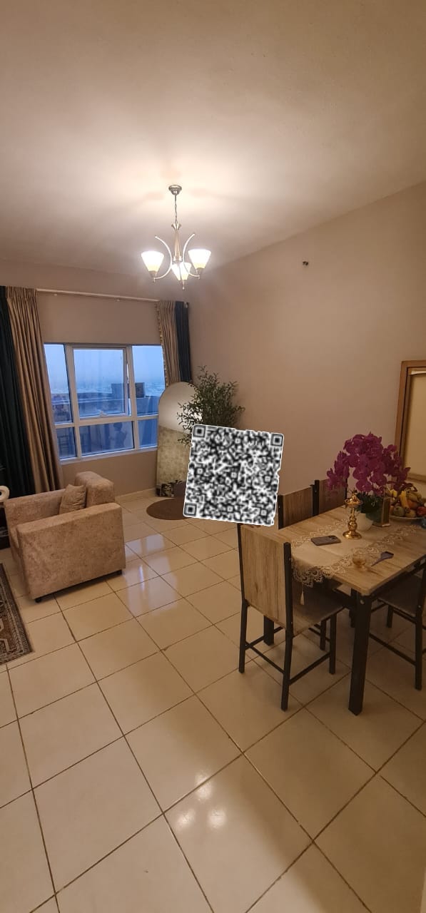 Own your apartment with an attractive side view of Ajman Creek — a spacious two-bedroom apartment with a living room, offering generous living space.