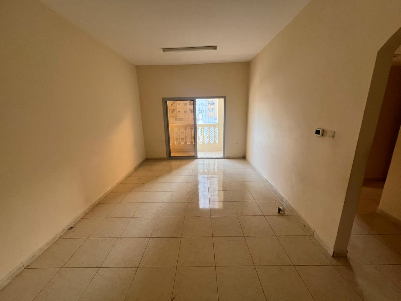 Two-bedroom apartment for annual rent in Ajman – Prime location Al Rashidiya 1 – Al Mina Street, near Ajman Markets Co-op Balcony with open view Cl