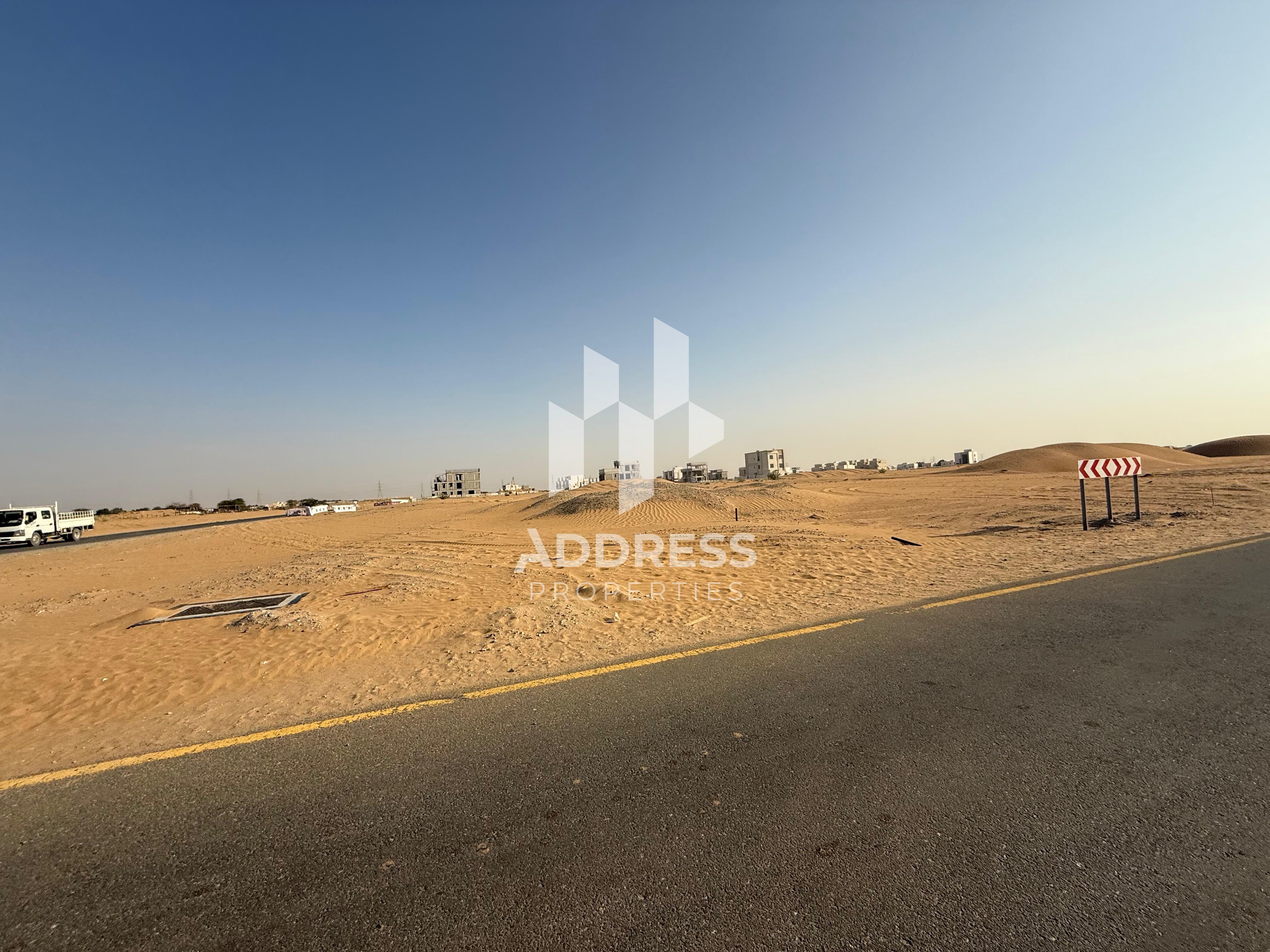 Commercial Land for Sale in Basateen Al Zubair – Prime Location on Emirates Crossing Road