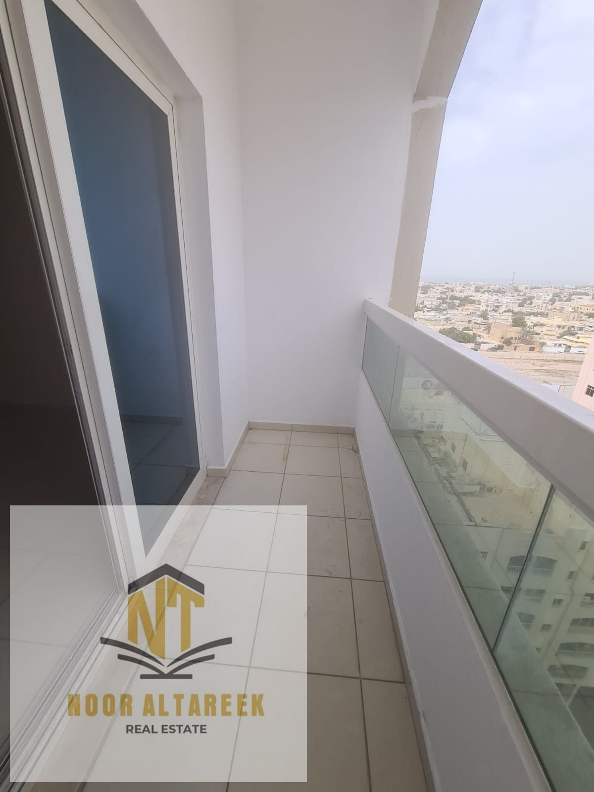 Annual rent in Al Majaz 3: One bedroom and living room with balcony and built-in wardrobes.