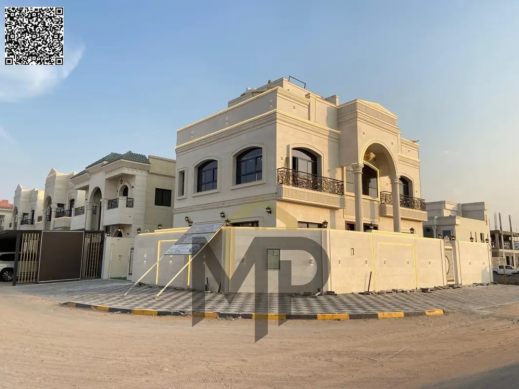 Classic corner villa with a large area and an internal roof opposite Al Hamidiya Park, central air conditioning, freehold ownership for all nationalit