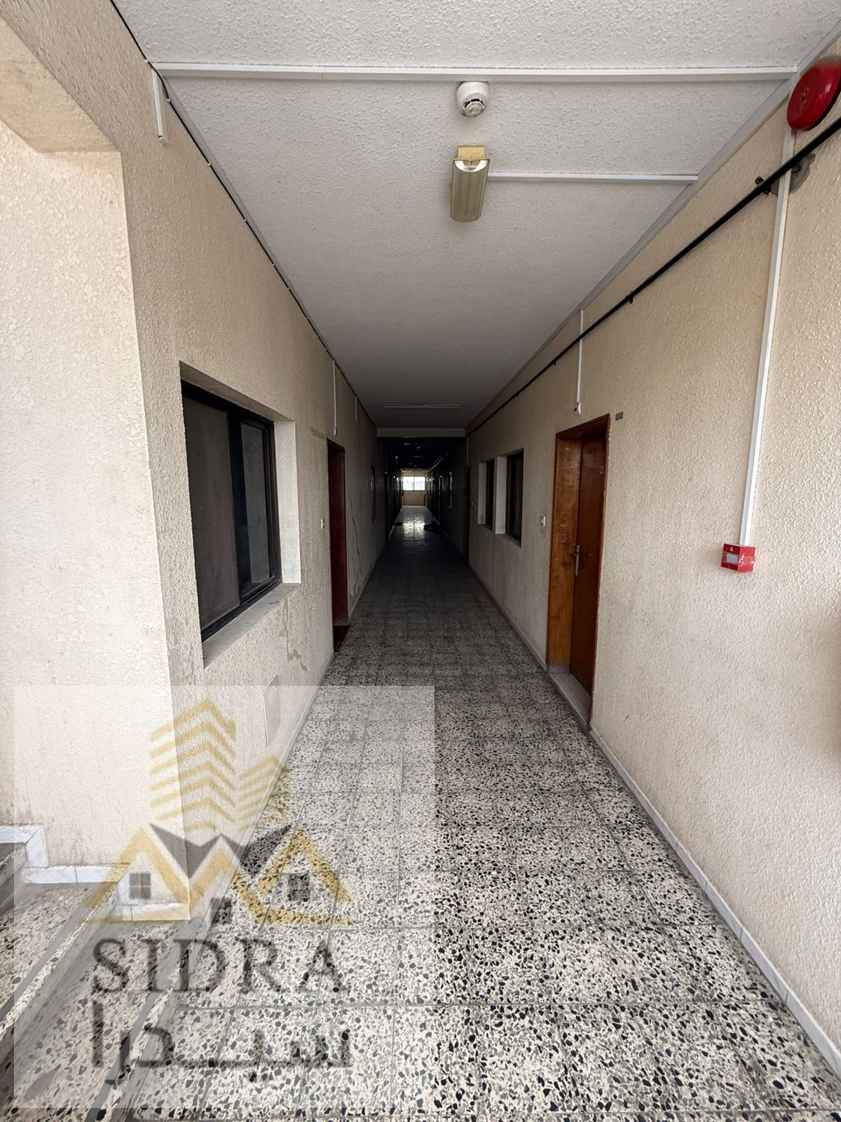Building for sale in the industrial area, situated on a prominent corner plot, with a total area of 8,400 sq. ft