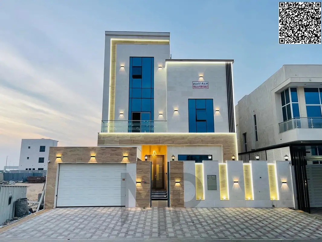 "A golden opportunity to own your dream villa in Al Bahia - Ajman: 7 master bedrooms at a price including registration fees, modern design, and a roof