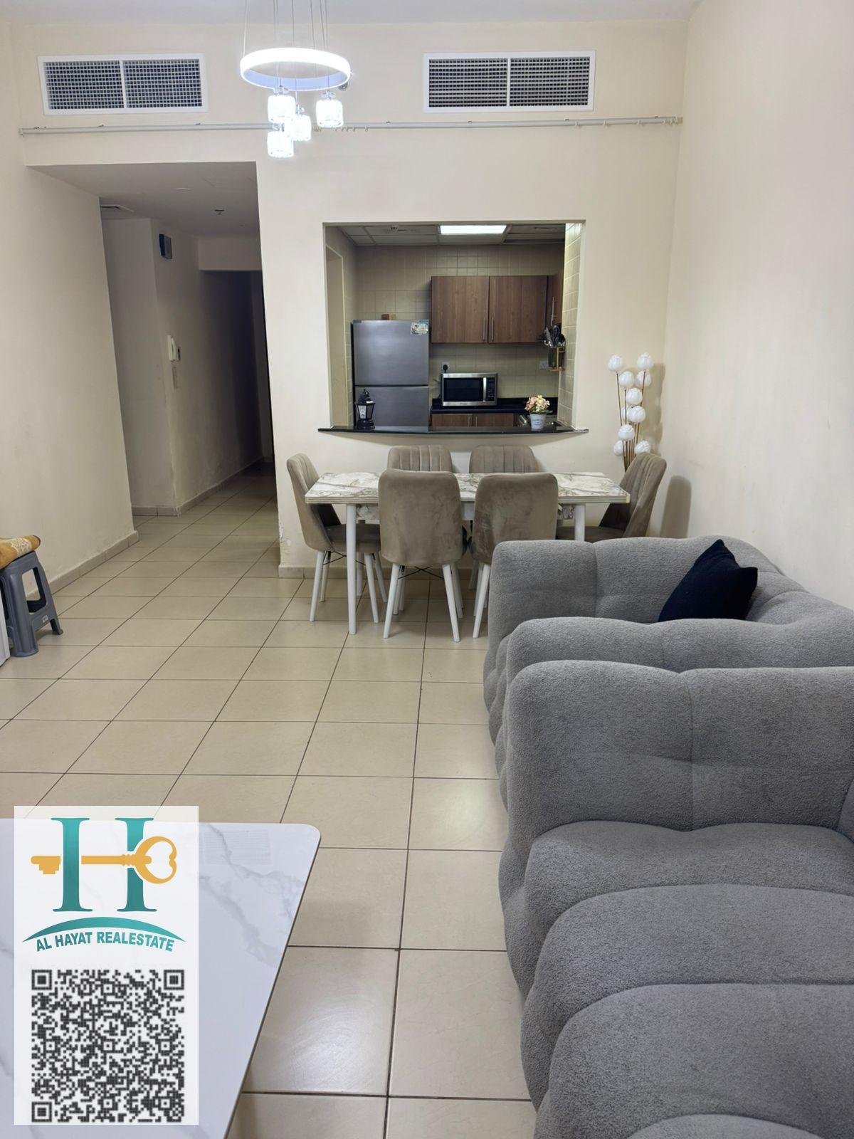 Two rooms and a living room with a balcony