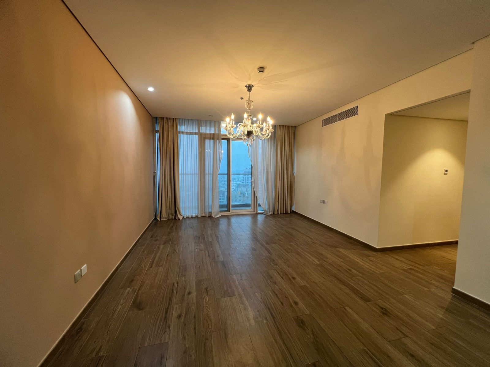 Luxury two-bedroom apartment with a living room for annual rent in Sharjah, near Dubai exit, with free parking, gym, and swimming pool.