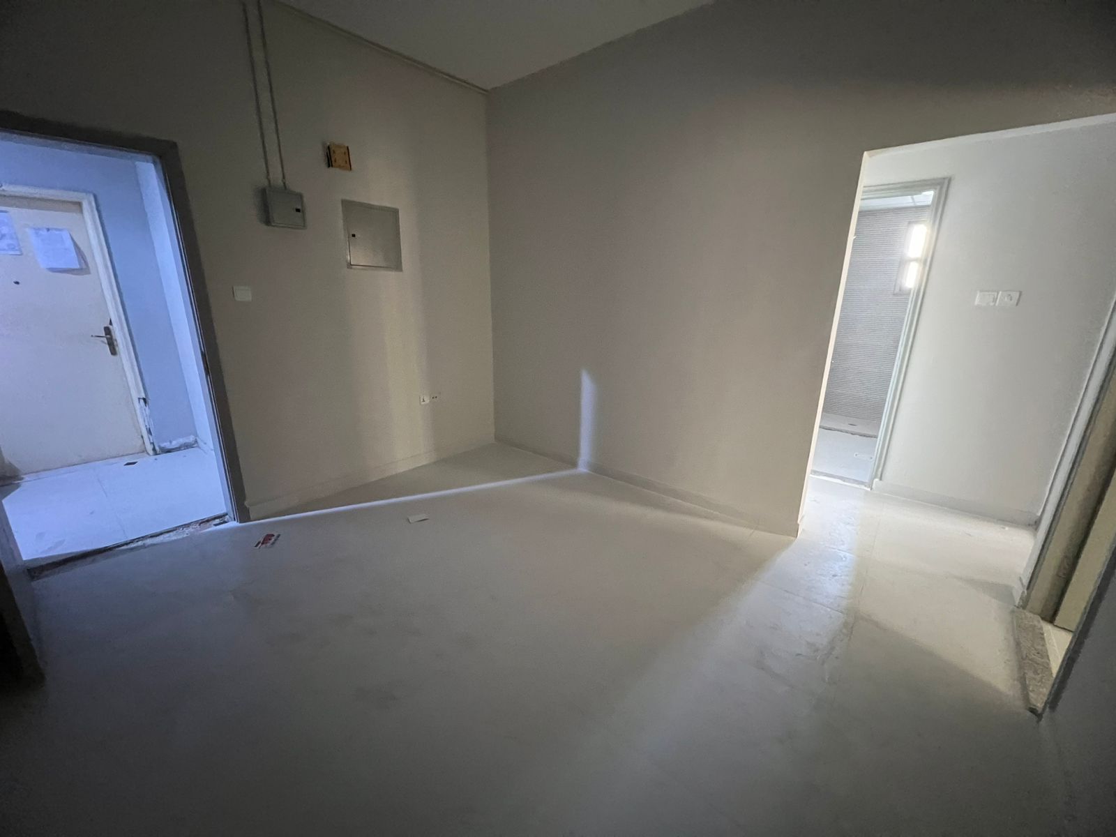 Annual apartment for rent in Al Taawun with two bedrooms, living room and balcony, suitable for employees, workers or staff, near Dubai exit