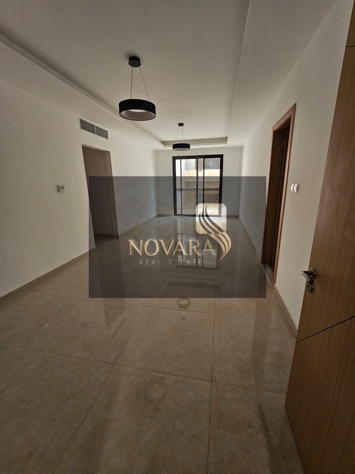 Apartment for rent, first occupancy, in Al Jurf Industrial Area 3 - 2 bedrooms, living room, and 3 bathrooms