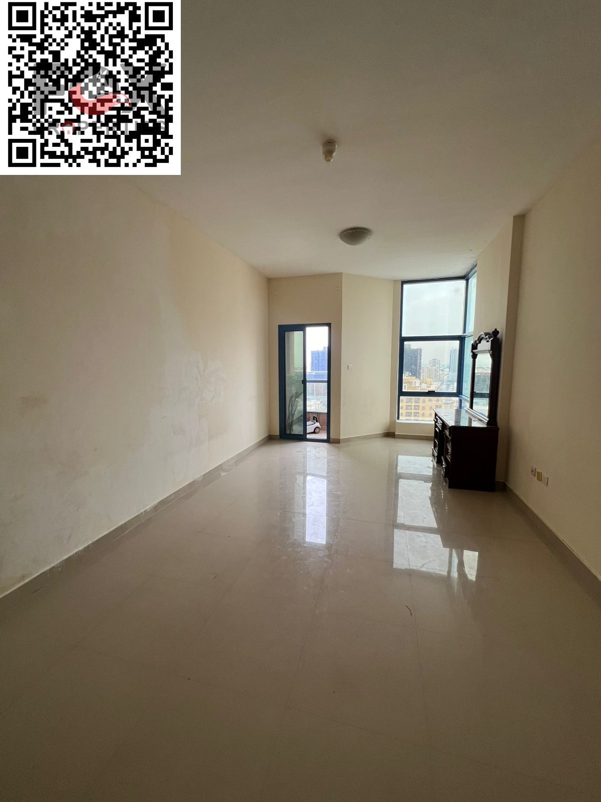 Two bedrooms and a living room for rent in Al Nuaimiya Towers, Tower C, with parking. Prime location, comfortable spaces, and a reasonable price with