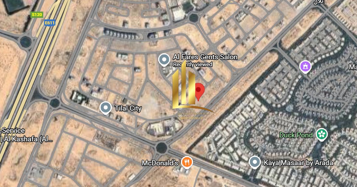 Corner plot for sale in Tilal City, opposite Masar Project. Area: 5382 sq ft.