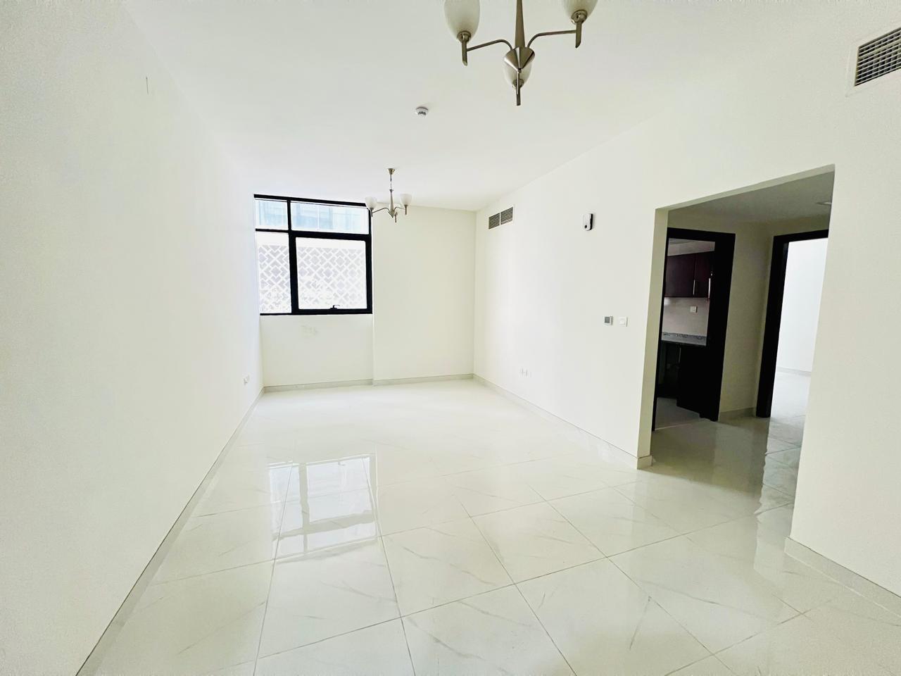 brand new building luxury living with open view balcony good finishing Master bedroom one parking free Maintenance free prime location near close exit to dubai