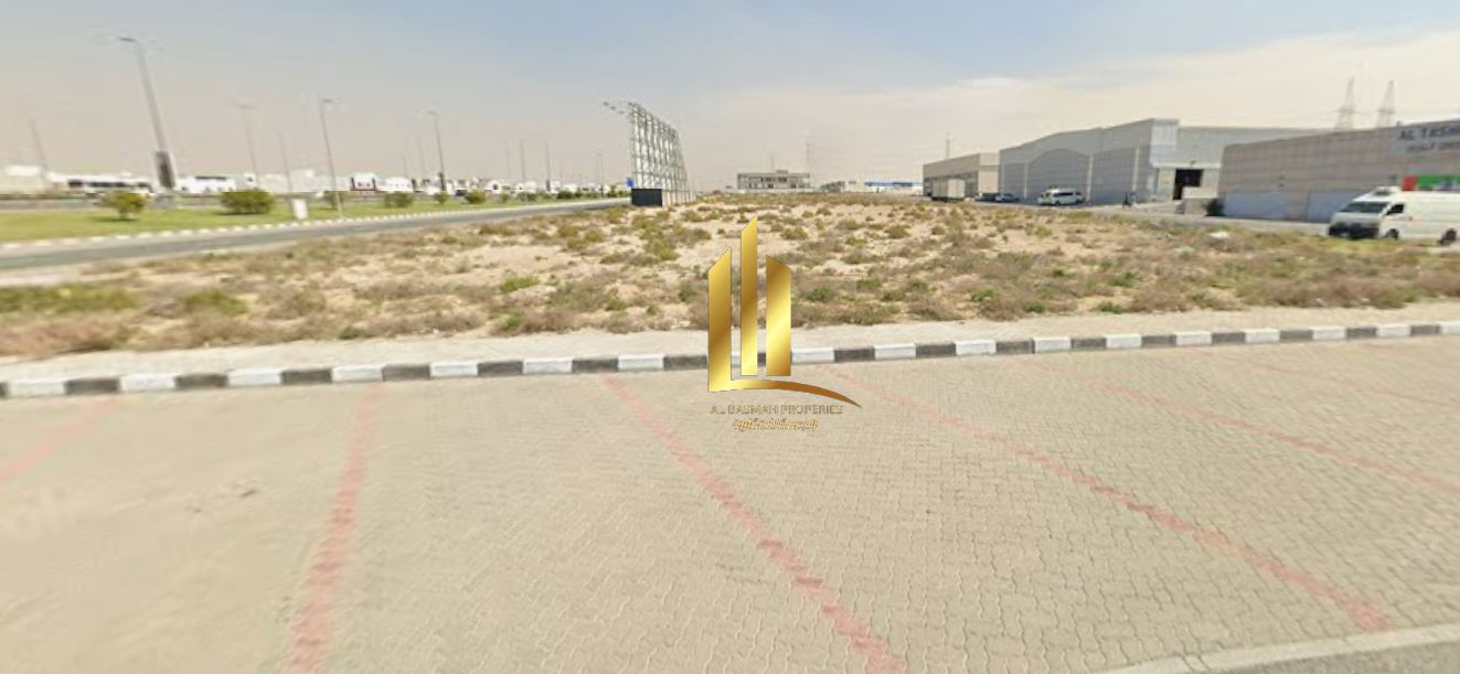 Industrial land for sale in Sharjah Industrial Area 18, directly on Maliha Road, corner plot on three streets.