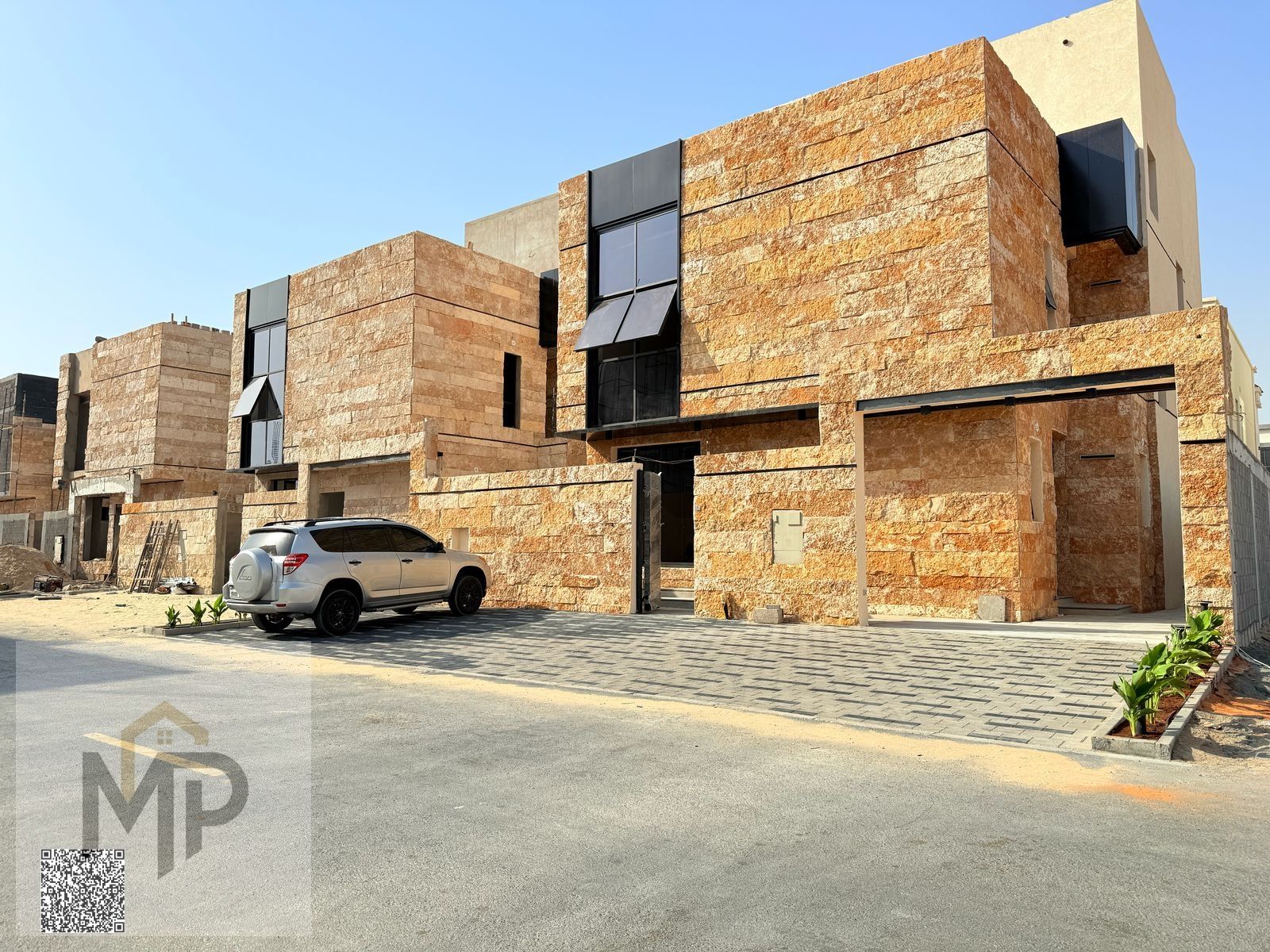 Villa for sale directly from the owner in Al Zahya with a 20-meter front setback and a stone facade. The villa includes registration and ownership fee