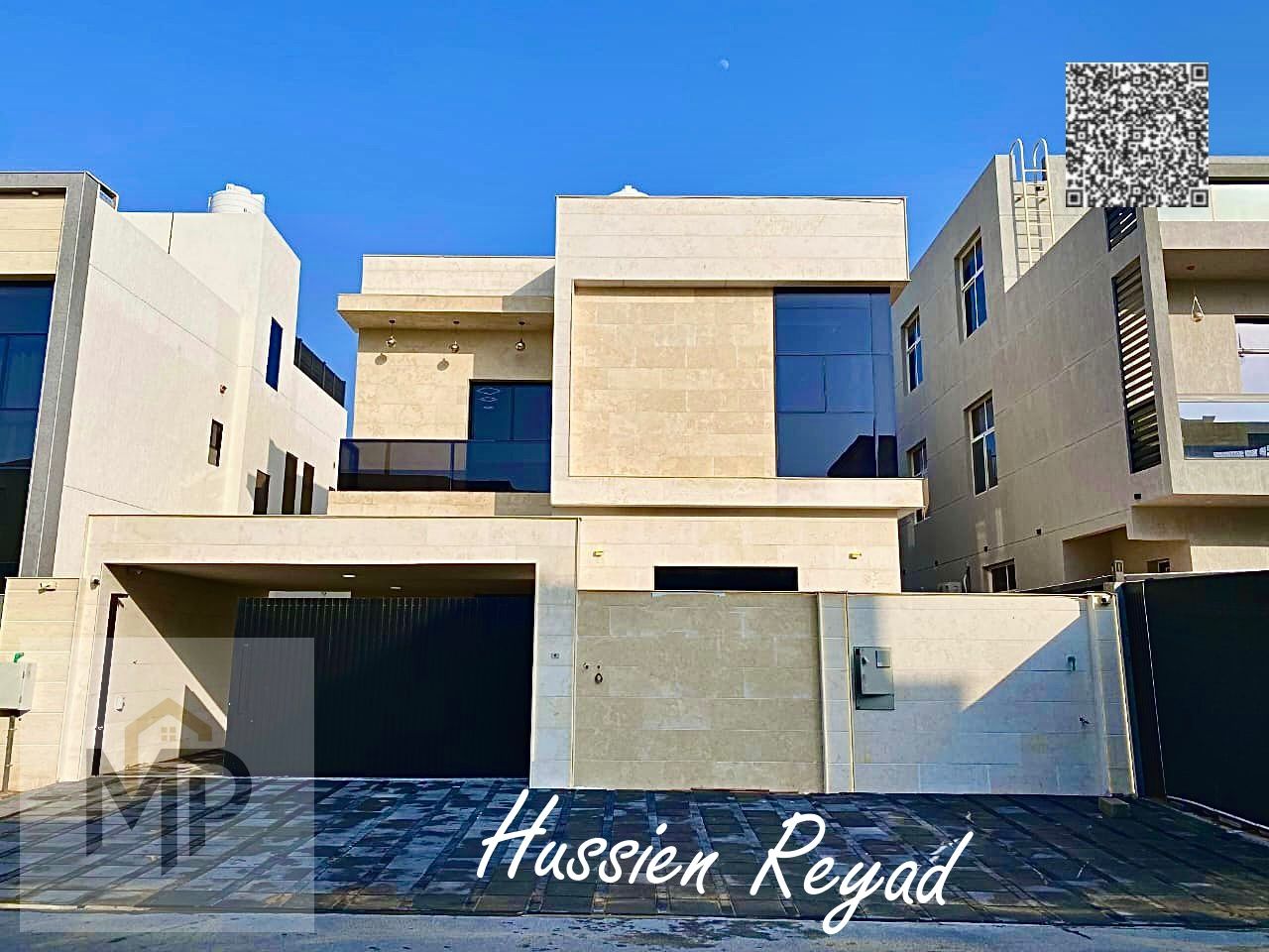Luxury villa for sale with two floors and a roof, central air conditioning and a spacious yard, near Sheikh Mohammed Bin Zayed Road, with freehold own