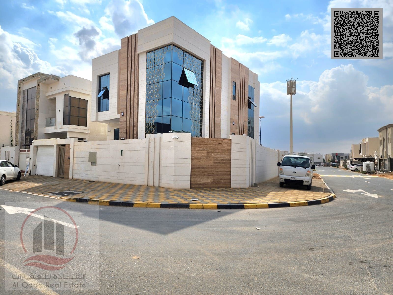 Corner villa for sale in Ajman, Al Zahiyah area. 5 master bedrooms, living room, majlis, maid's room, and roof terrace. Freehold ownership available