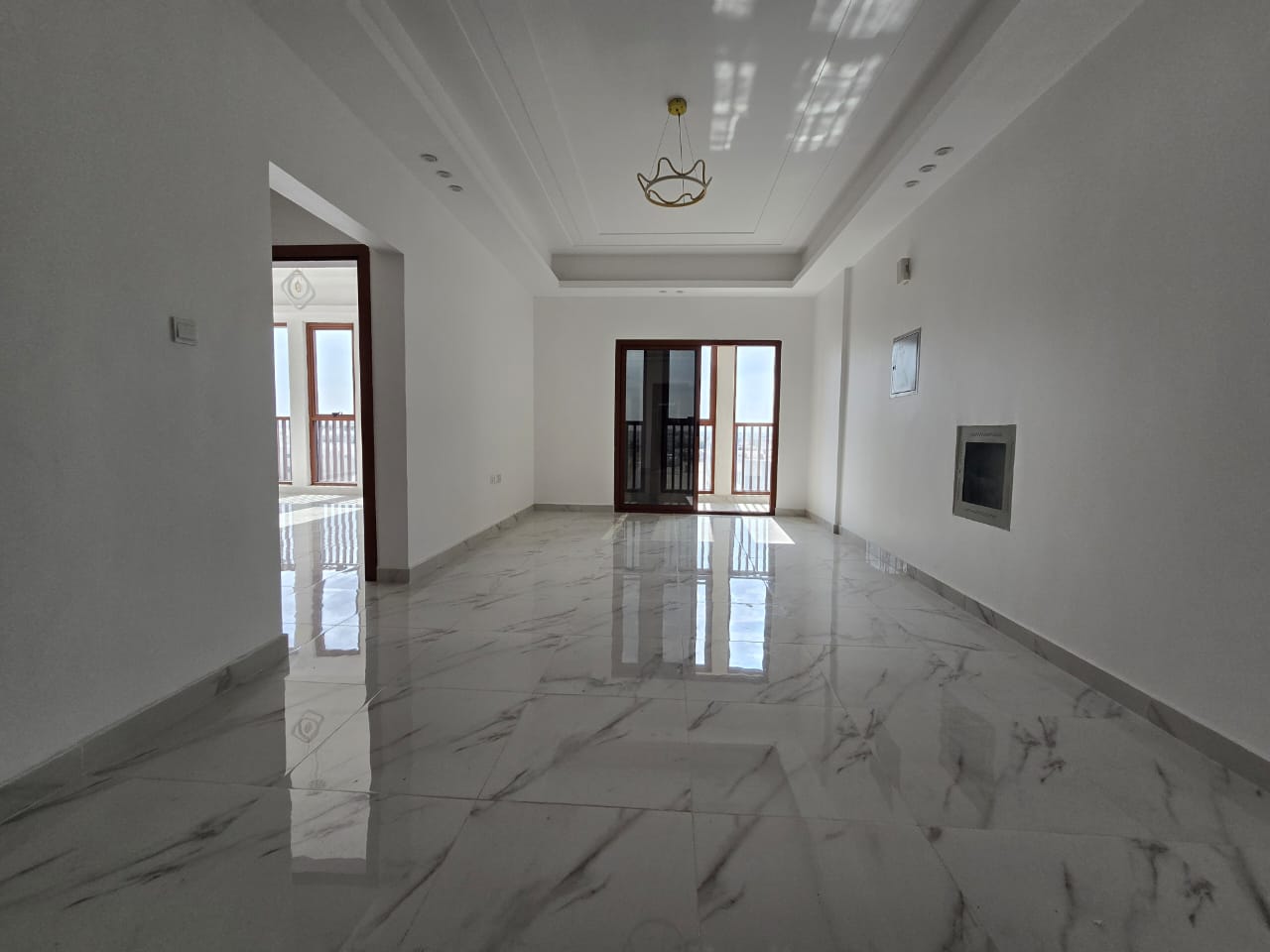 Brand new building, first occupancy, master bedroom, living room, super deluxe finishing, central air conditioning, easy access to Sharjah and Dubai
