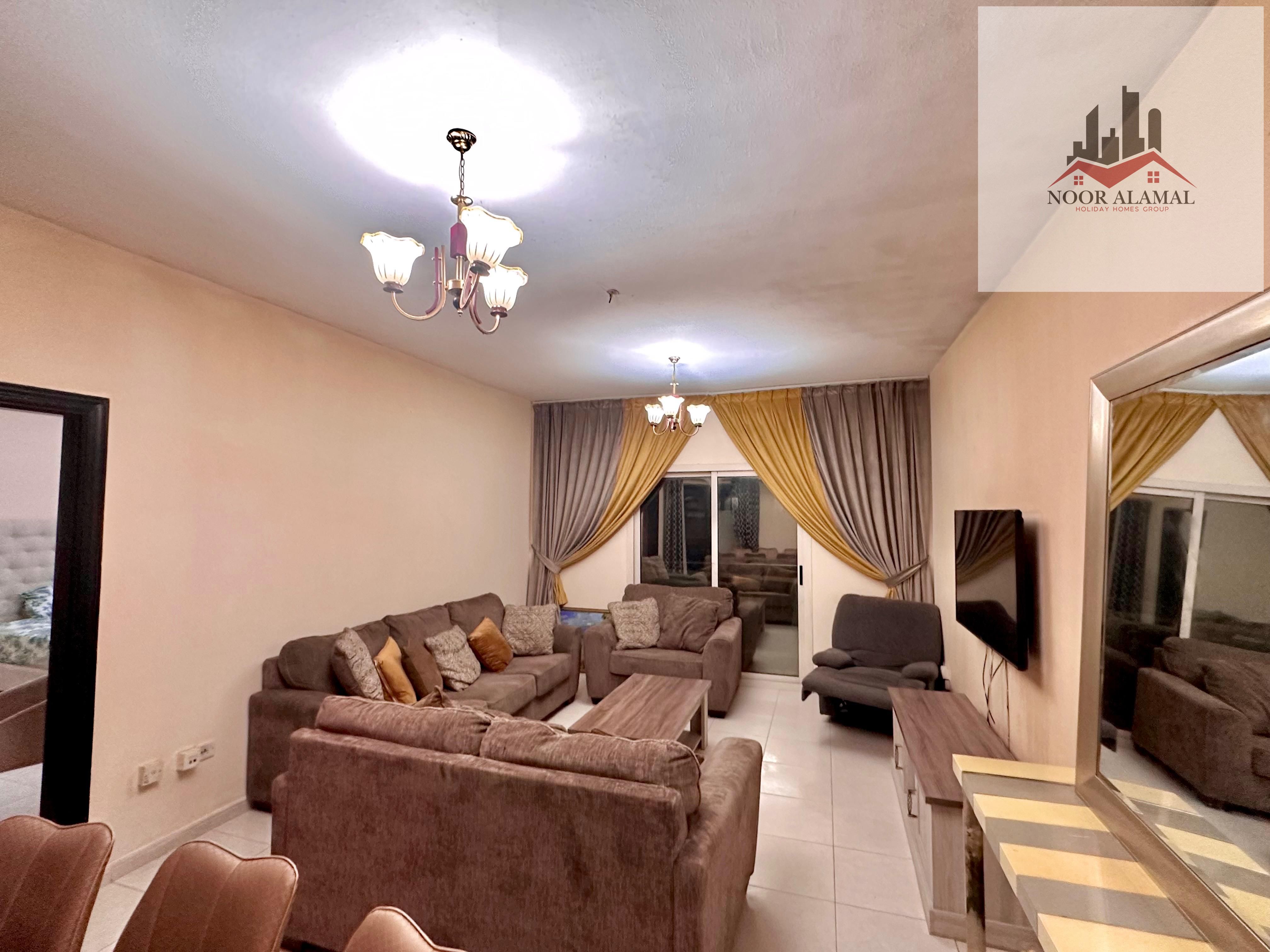 Apartment for rent in Sheikh Tariq Building, one bedroom, living room, kitchen, two bathrooms, spacious layout, and two balconies.