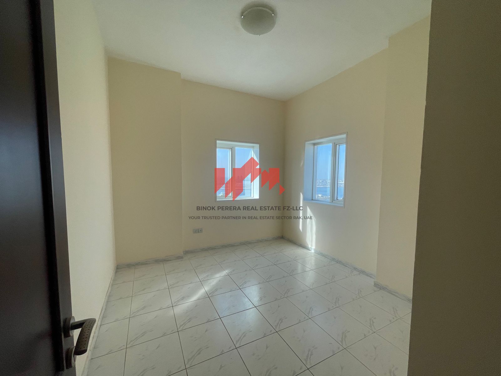 Spacious 2 BR in RAK Tower: Perfect Family Retreat