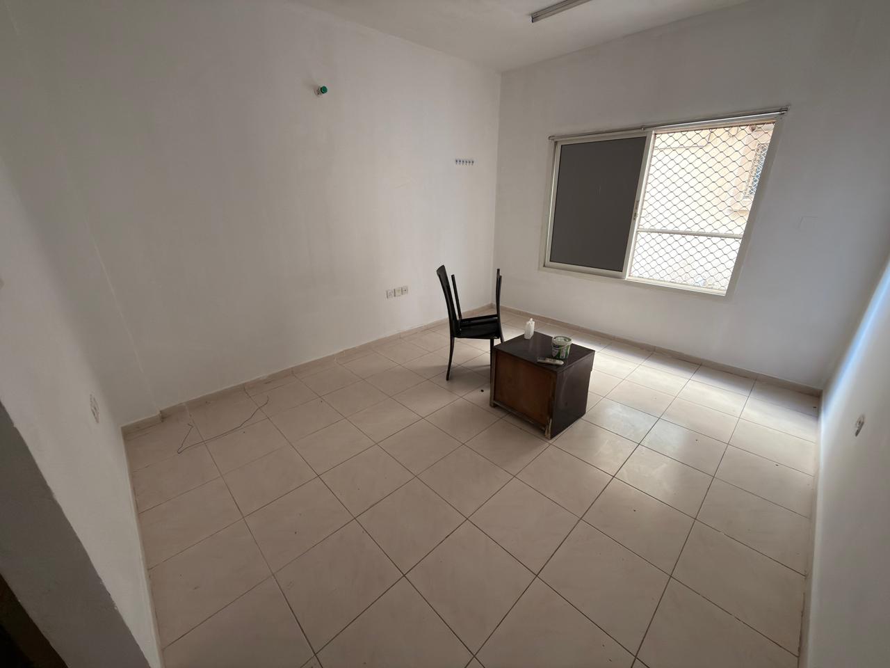 A distinctive studio apartment for annual rent, featuring a semi-separate kitchen, split air conditioning, and full maintenance provided by the owner.