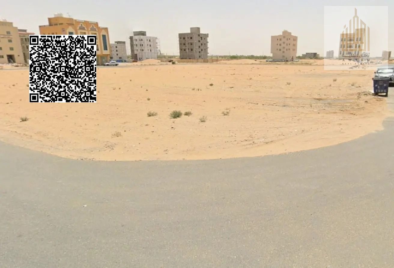 Land for sale in Al Alia, Ajman Global City, on an asphalt road Land for sale in Al Alia, Ajman Global City - For sale in Al Alia, Ajman Global City