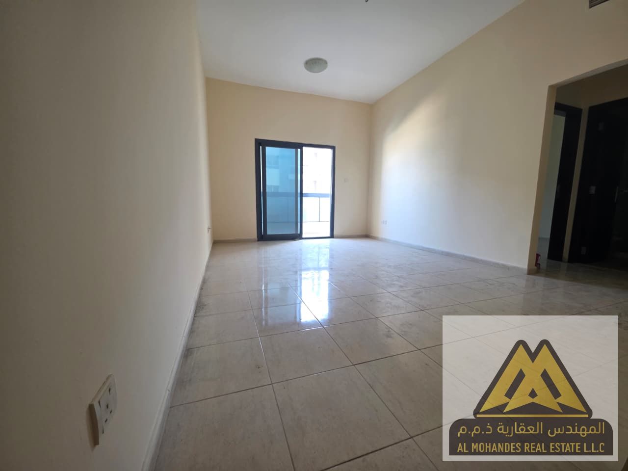 1BR + living room for annual rent in Al Rashidiya 1, Ajman – prime main road location, family-only, AED 33,000 in 4 or 6 installments