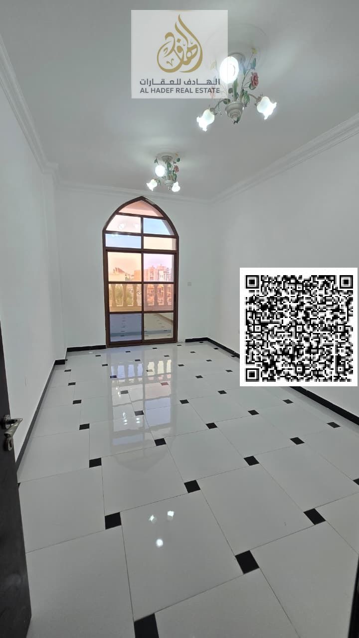 A separate one-bedroom apartment with a living room in Al Rawda 3, near Khartoum Street and the Dubai and Sharjah exit. It features two bathrooms, a b