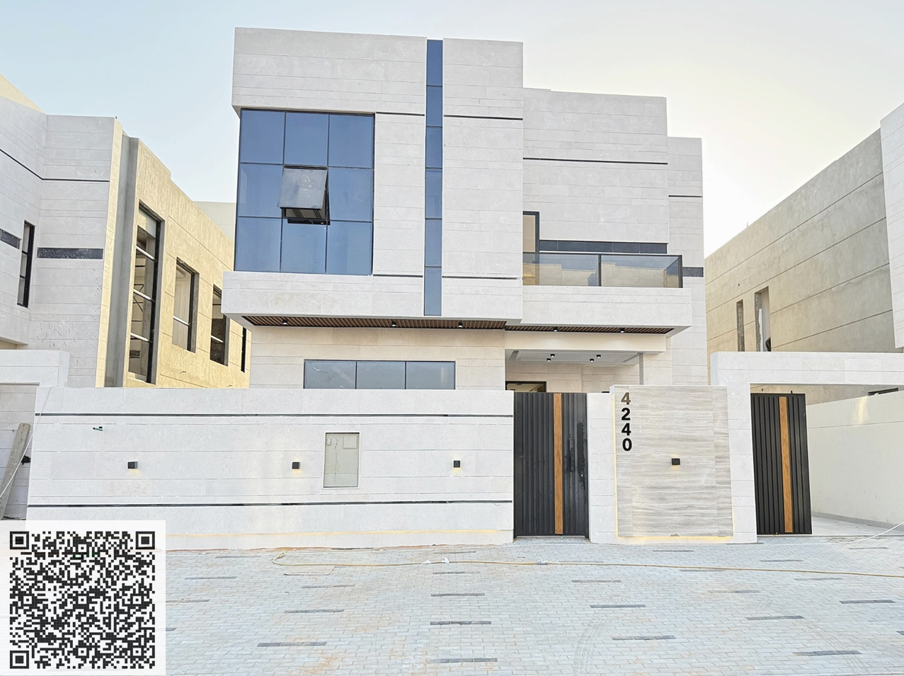 Modern villa for sale in Al Helio 2 area, Ajman. Excellent location on a main street. Two floors. Price includes registration fees. Land area: 3014 sq