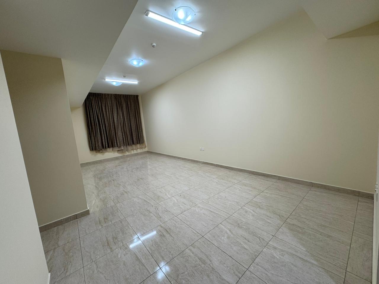 **Three-bedroom apartment with storage for annual rent, second occupancy in Al Jurf 3 near Mohammed Bin Zayed Street, 3 baths, built-in wardrobes, AC.