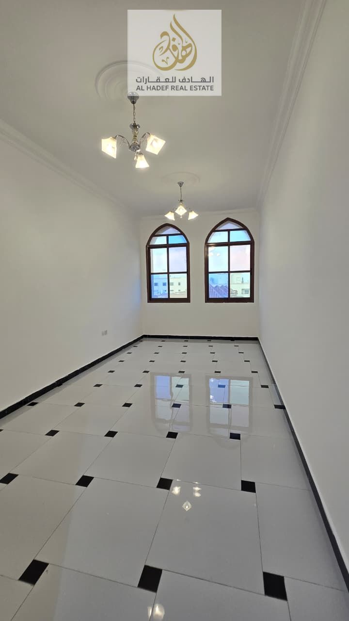 Annual rent in Ajman, Al Rawda 3 area, near Sheikh Ammar Street. Families only. One-bedroom apartment with living room, central air conditioning, two