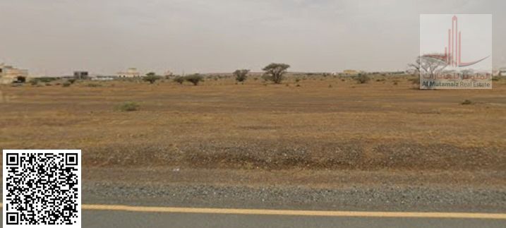 For sale in Ajman, a residential and commercial plot of land, Masfout - Basin 1, the plot is on the corner of a street ASKING 260000