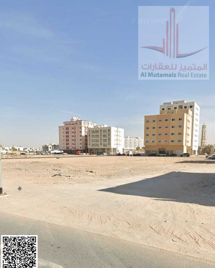 For sale in Ajman, land in Al Rawda, the second plot from Sheikh Maktoum Street, area 9881, residential and commercial license G + 6, asking 4400000