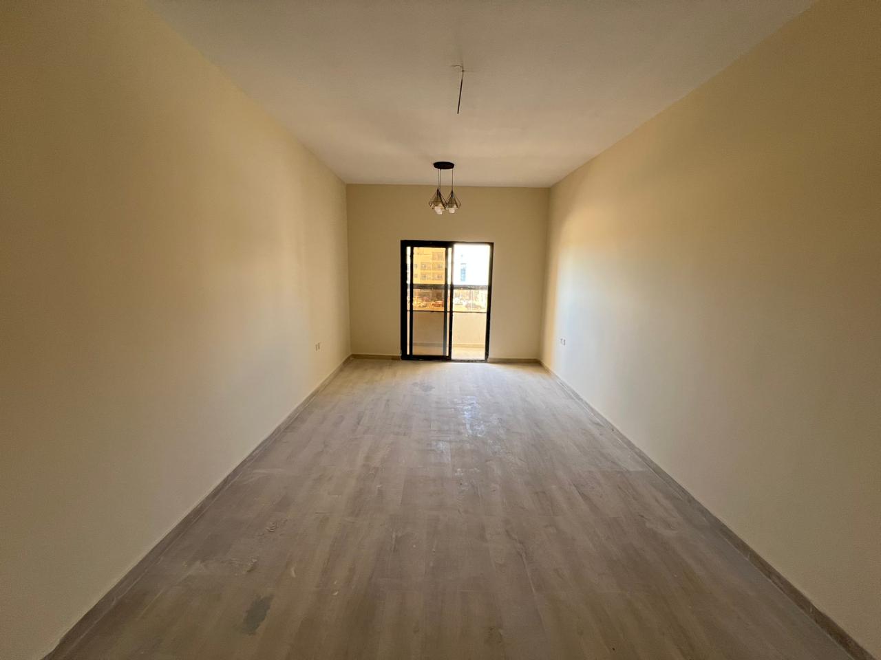 Studio apartment, first occupancy, new building, large area with balcony, central air conditioning, easy access to Sharjah and Dubai exits, Al Jurf