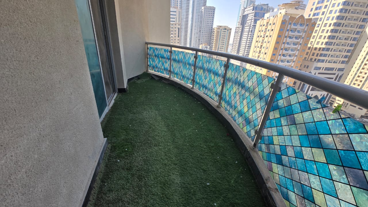 Three-bedroom apartment with balcony in Al Majaz 3 Corniche, all rooms master plus maid room, open sea view, parking included.