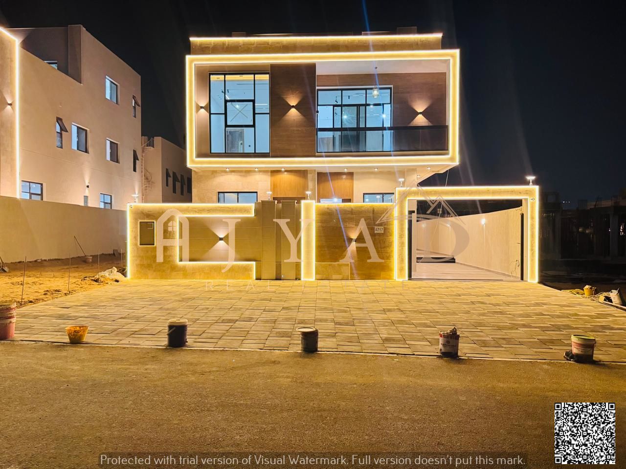 Modern villa for sale in Al Bahia, Ajman. Excellent location on a main street. Two floors plus a roof. Price includes registration fees. Built-up area