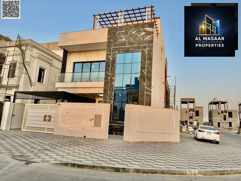 Corner villa, price inclusive of registration and ownership fees, on the main street, ready to move in, in one of Ajman's most prestigious areas, free