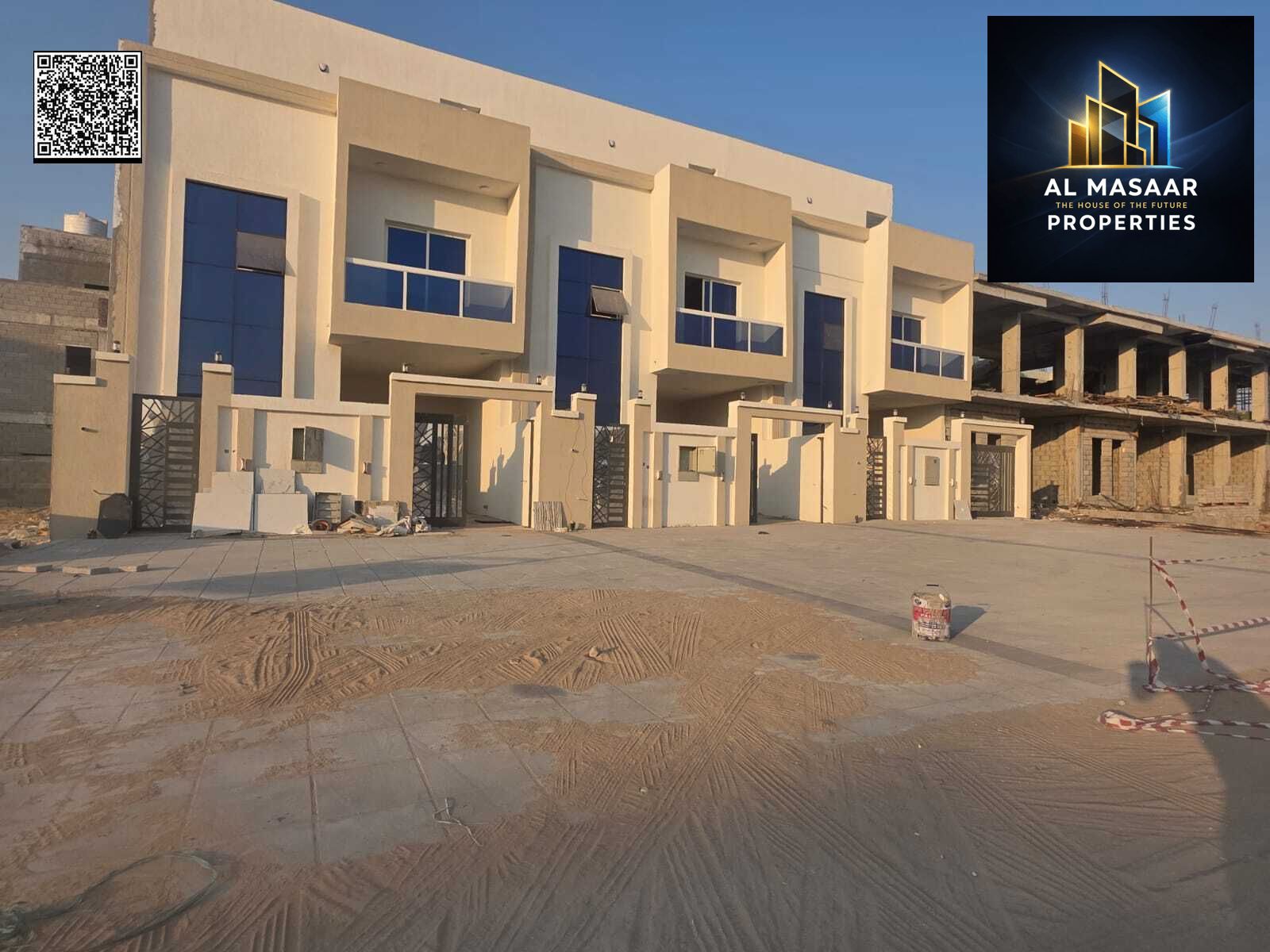 Villa for sale in Ajman, Al Helio 2 area. The villa consists of 4 master bedrooms, a majlis (formal sitting room), a living room, and a maid's room. F