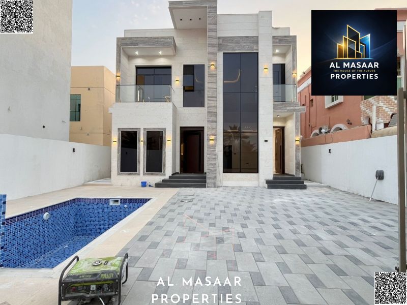 Luxury villa with a swimming pool and elegant architectural design in Rawda 2 on Sheikh Ammar Street | 5 master bedrooms + majlis + 2 living rooms | P