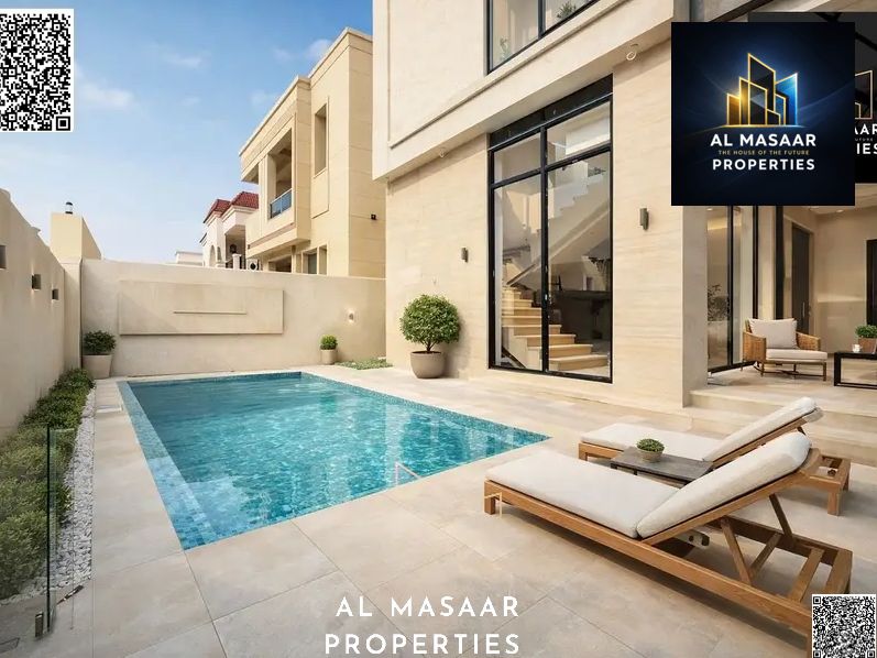 Luxury villa in Al Yasmin with a swimming pool and views of Al Hamidiya Park, ready for immediate occupancy. Freehold ownership for all nationalities.