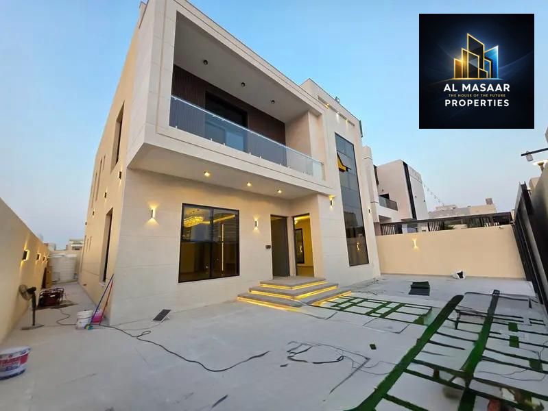 For sale in the Al Amirah area: a new luxury villa with a modern design and elegant finishes, in a prime location close to services, easy access to Du