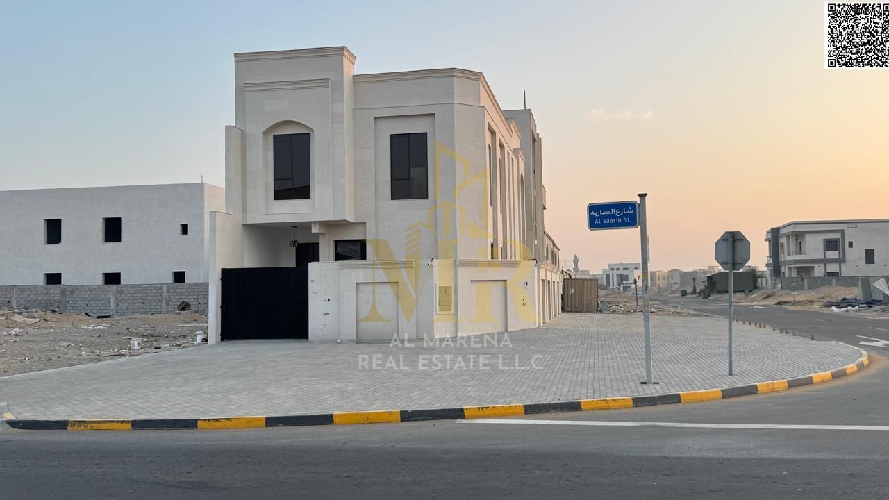 Luxury corner villa in Al Helio 2, Ajman, ready for immediate occupancy with high-end finishes and spacious living areas. Price includes registration