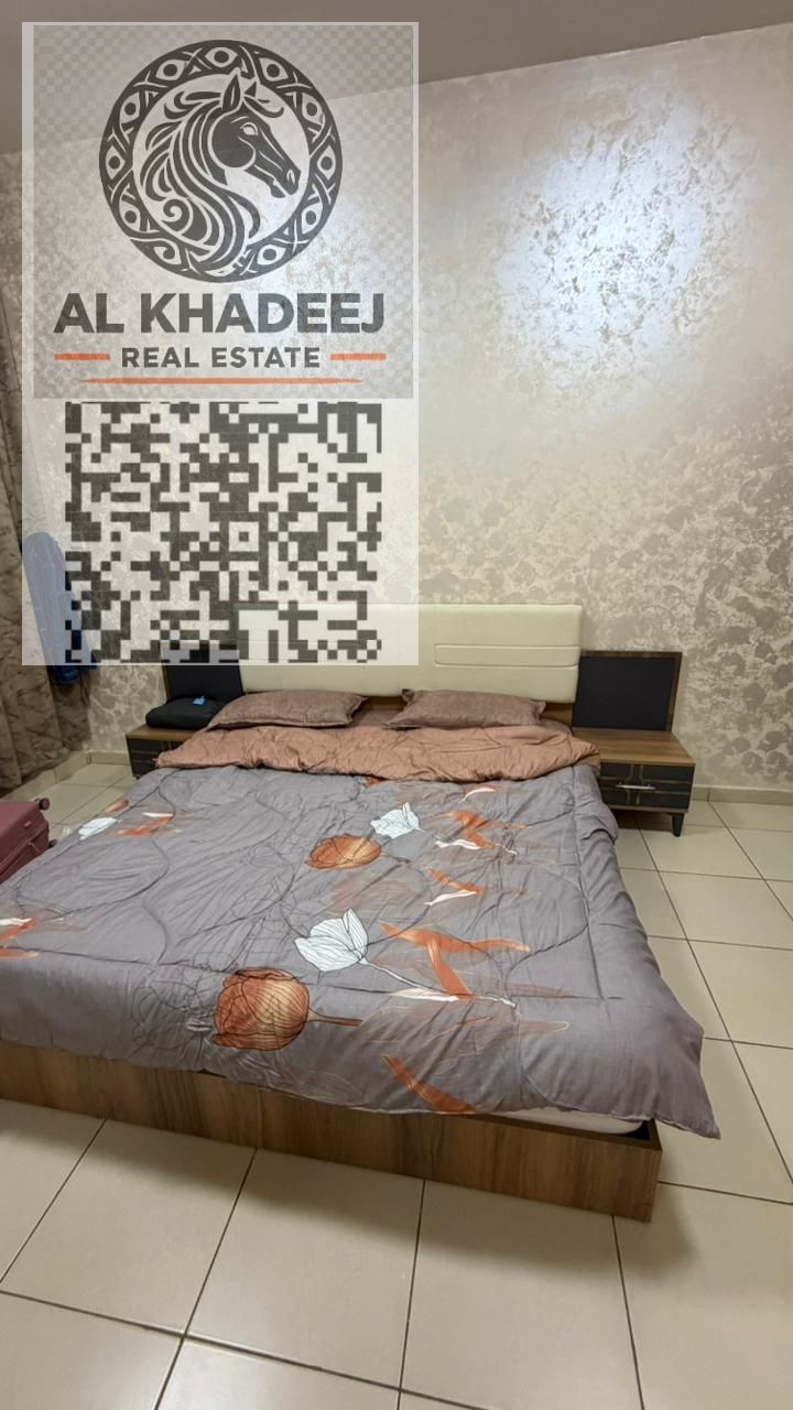Two-bedroom apartment for sale in Ajman One Tower with city and garden views, close to all amenities.