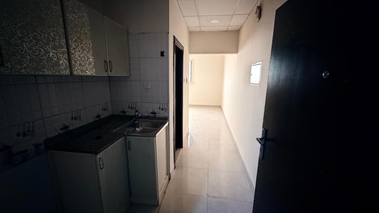 Second-hand studio apartment for annual rent in Ajman, ready for immediate occupancy. Features a separate kitchen and central air conditioning. Prime
