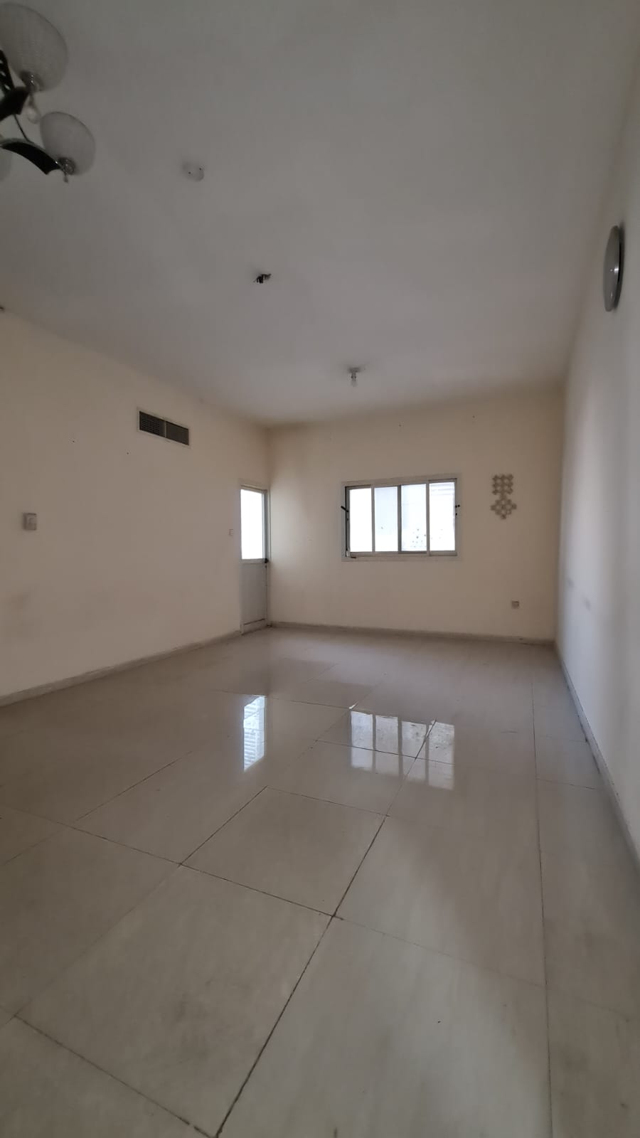 Two-bedroom family apartment in Al Qasimia (Al Mahatta), central AC, prime location near all services and Dubai exit