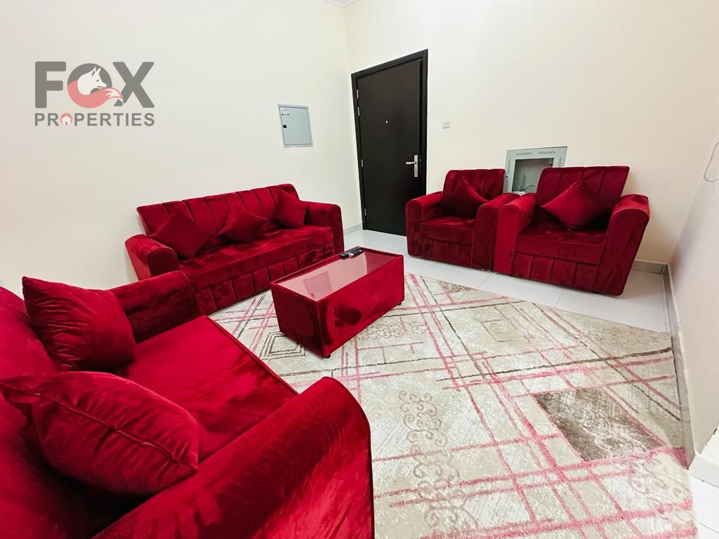 One-bedroom apartment with a living room in the Al-Rawda area, easy access to Dubai and Sharjah, 2 bathrooms, a balcony, central air conditioning, and