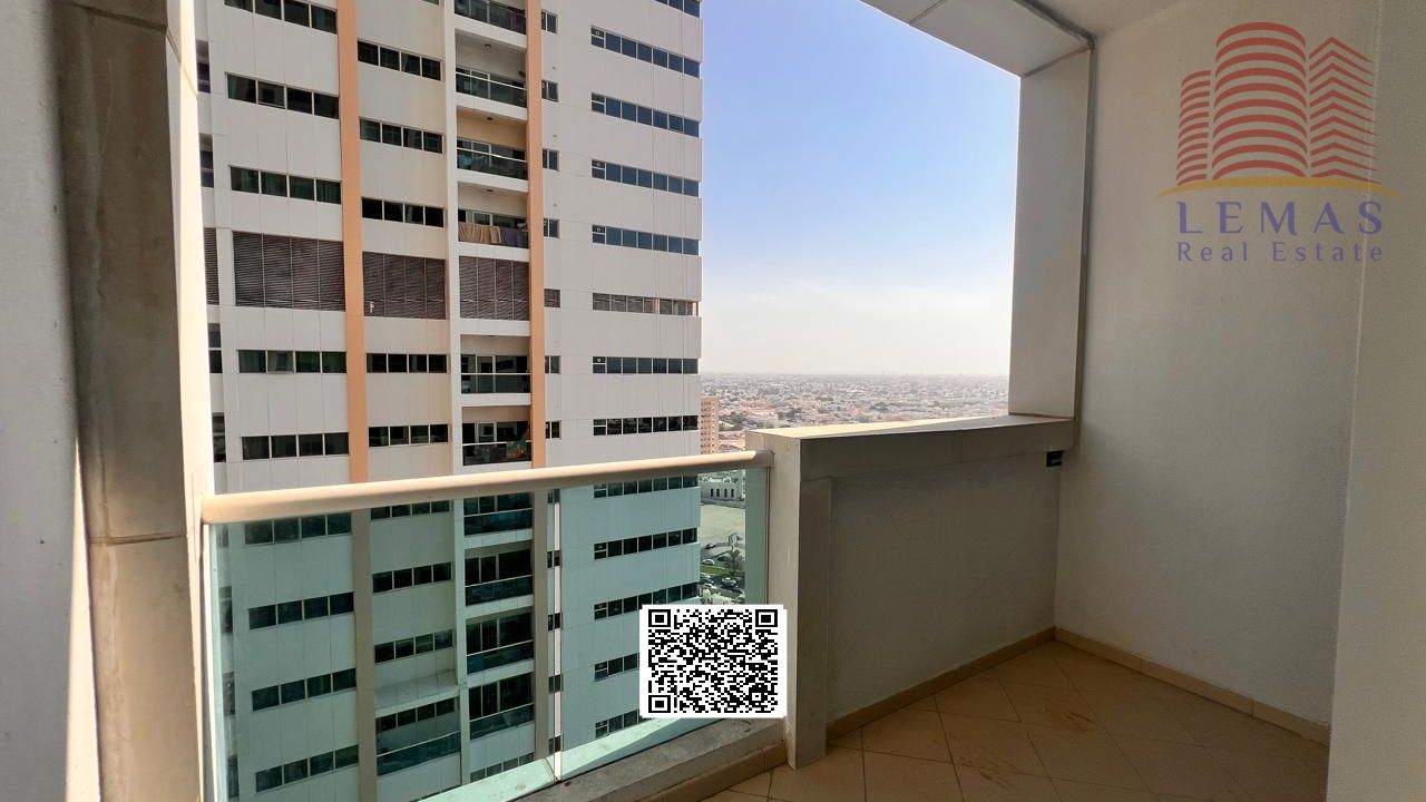 Two-bedroom apartment with a living room, available for purchase with a down payment of AED 300,000.